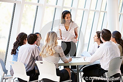 Business People Having Board Meeting In Modern Office Stock Photo