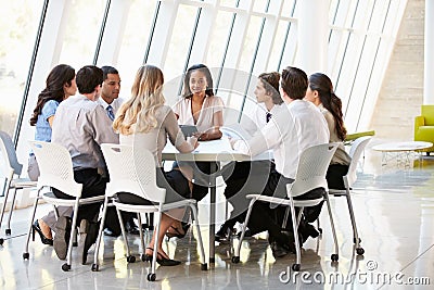 Business People Having Board Meeting In Modern Office Stock Photo