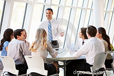 Business People Having Board Meeting In Modern Office Stock Photo