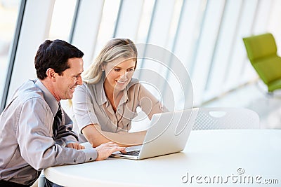 Business people Having Meeting Around Table In Modern Office Stock Photo