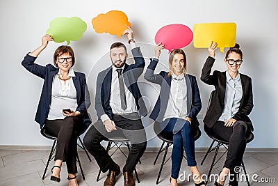 Business people holding colorful bubbles Stock Photo