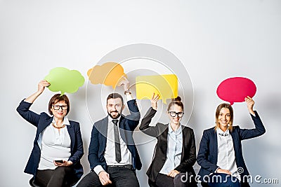 Business people holding colorful bubbles Stock Photo