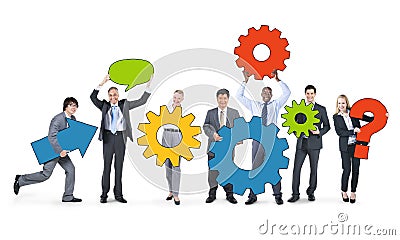 Business People Holding Gears Together Stock Photo