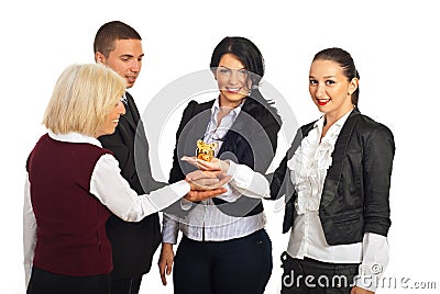 Business people holding piggy bank Stock Photo