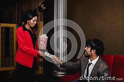 Business people are invited to watch movies and give money to buy movie tickets Stock Photo