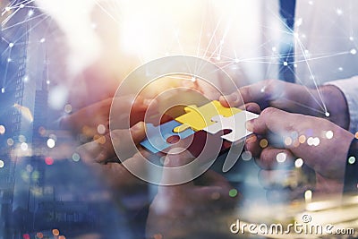 Business people join puzzle pieces in office. Concept of teamwork and partnership. double exposure with internet network Stock Photo