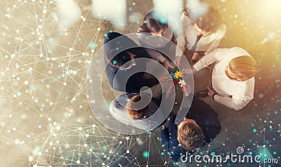 Business people join puzzle pieces in office. Concept of teamwork and partnership. double exposure with internet network Stock Photo