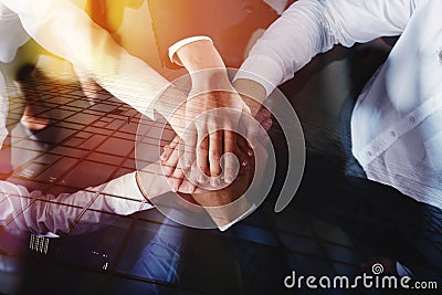 Business people joining hands in the office. concept of teamwork and partnership. double exposure Stock Photo