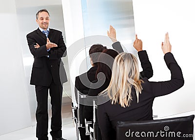 Business people at the lecture asking questions Stock Photo
