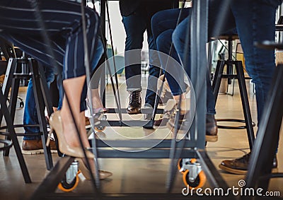 Business people legs under the office table Stock Photo