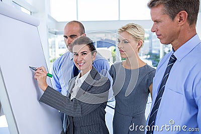 Business people looking at conference board Stock Photo