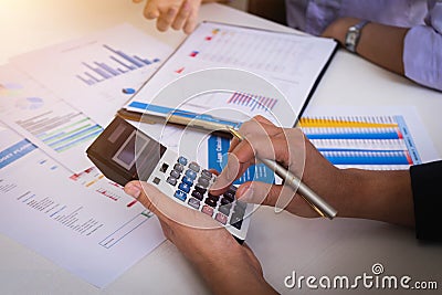 Business people meeting to analyze and discuss the situation on the financial report in meeting room. Meeting planning budget and Stock Photo