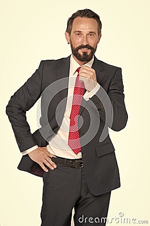 business, people and office concept - happy smiling businessman in suit. Bearded businessman in blue suit and red tie isolated on Stock Photo