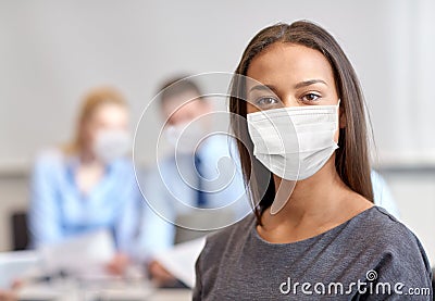 African american businesswoman in mask at office Stock Photo