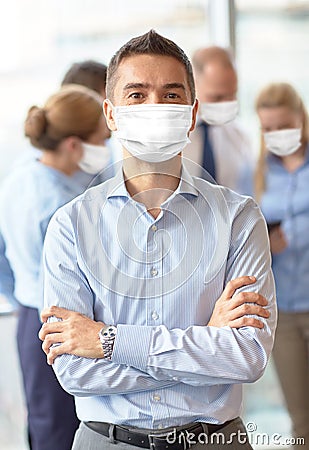 Businessman wearing face protective mask at office Stock Photo