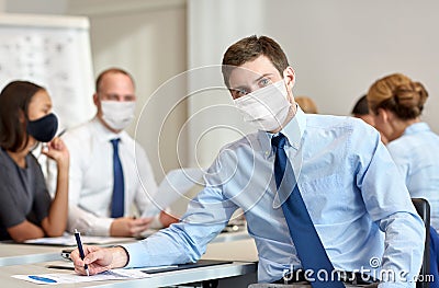 Businessman wearing face protective mask at office Stock Photo