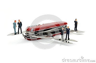 Business people on penknife Stock Photo