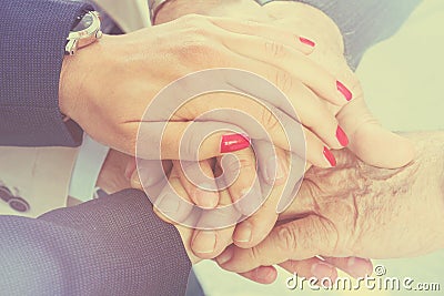 Business people putting their hands together. Arms consolidation Stock Photo