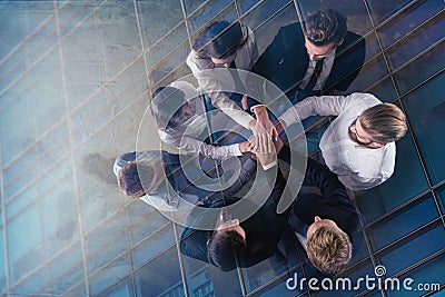 Business people putting their hands together. Concept of integration, teamwork and partnership. double exposure Stock Photo