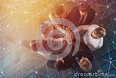 Business people putting their hands together with internet network effects. Concept of integration, teamwork and Stock Photo