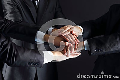 Business people putting their hands Stock Photo