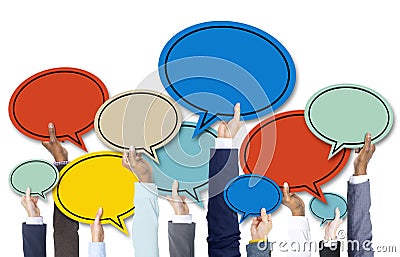 Business People's Hands Holding Colorful Speech Bubbles Stock Photo