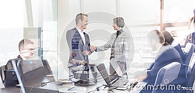 Business people shaking hands in moder corporate office. Stock Photo