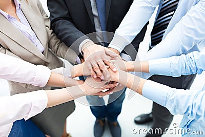 Business people stacking hands Stock Photo