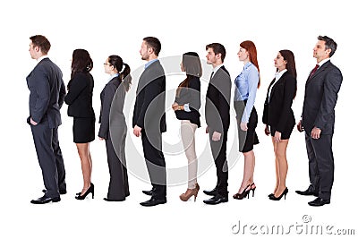 Business people standing in queue Stock Photo