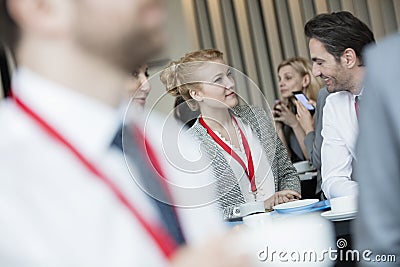 Business people talking at lobby in convention center Stock Photo