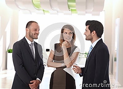 Business people talking in office corridor Stock Photo