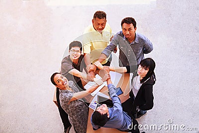 Business People Teamwork Meeting joining hands in office concept, Using Ideas, Charts, Computers, Tablet, Smart devices on busines Stock Photo