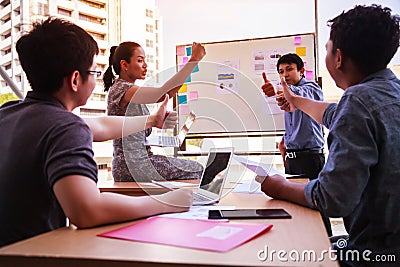Business people thumb up over table in a planning meeting at modern office. Teamwork, diversity, collaboration concept Stock Photo