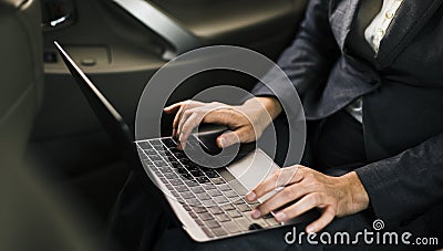Business People Using Laptop Networking Car Inside Concept Stock Photo