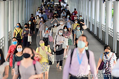 Business people wearing surgical mask for prevent coronavirus outbreak in rush hour at Bangkok Editorial Stock Photo