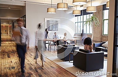 Business people at work in a busy luxury office space Stock Photo