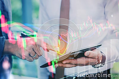 Business people working on digital tablet stock market exchange Stock Photo