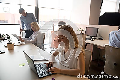 Business people working in modern office, using computers, busy workday Stock Photo