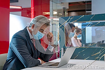 Business people working in public places with partition to keep social distancing Stock Photo