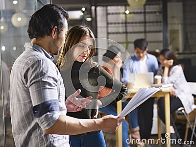 Business people working in small start-up company Stock Photo