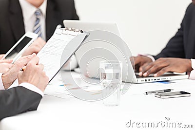 Business People Writing Note In Meeting Stock Photo
