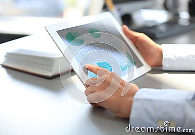 Business person analyzing financial statistics Stock Photo