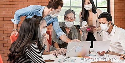 Business person brainstorm in meeting room with face mask Stock Photo