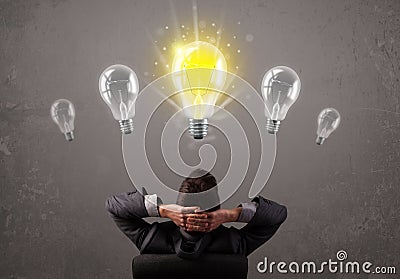 Business person having an idea light bulb concept Stock Photo