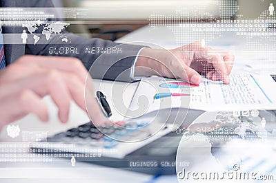 Business person using calculator against technology background Stock Photo