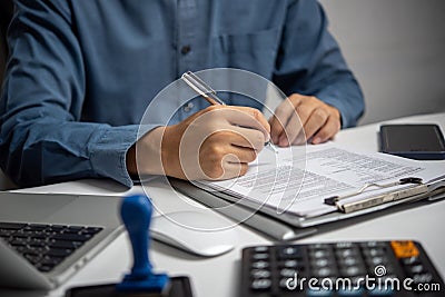 Business person Writing contract law and paper work for business and finance investments , write document, complete job Stock Photo