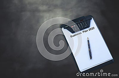 Business plan 2020 on chart with fountain pen on background Stock Photo