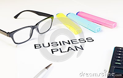 Business plan words near highlighters, calculator and glasses, business concept Stock Photo