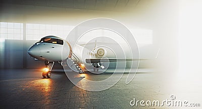 Business private jet airplane parked at maintenance hangar and ready for take off. Luxury tourism and business travel Stock Photo