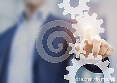 Business process automation and workflow improvement, businessman touching cogwheel, gears Stock Photo